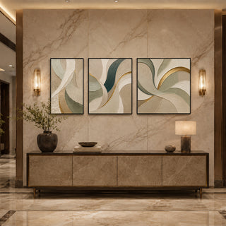 Black box framed gold spiral abstract relief triptych above a marble console