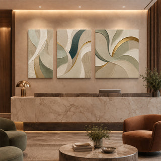 Gold spiral abstract relief canvas set of 3 in a marble reception lobby