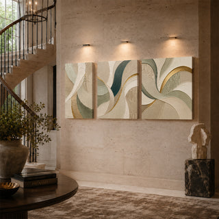 Cream and gold spiral abstract relief canvas triptych on a stairwell wall